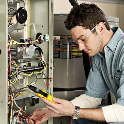 Service technician testing a furnace | Amazing Air Inc.